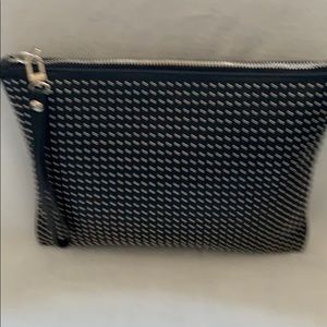 Black large wristlet/clutch with hand strap.